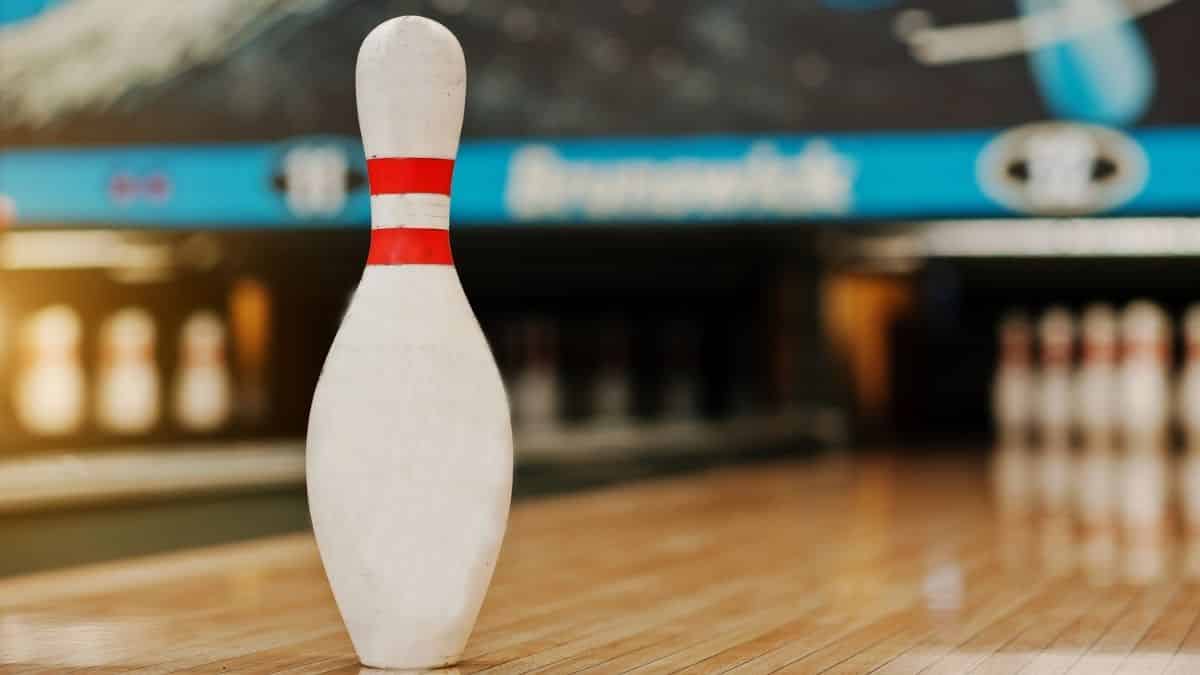 a single bowling pin in a bowling alley